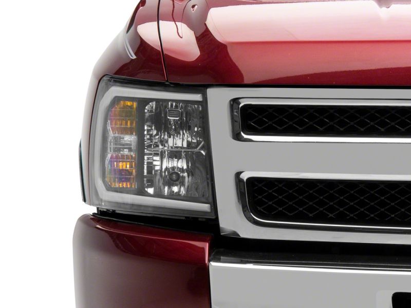 Raxiom 07-13 Chevrolet Silverado 1500 Axial Series Headlights w/ LED Bar- Black Housing (Clear Lens)