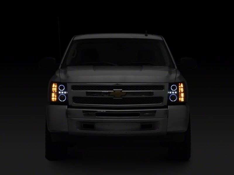 Raxiom 07-13 Chevrolet Silverado 1500 LED Halo Projector Headlights- Black Housing- Clear Lens