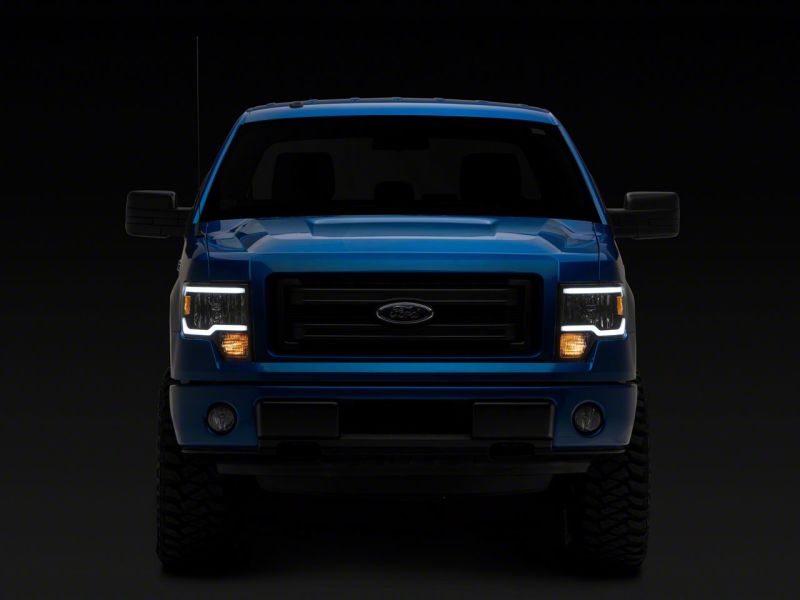 Raxiom 09-14 Ford F-150 Axial Series Headlights w/ LED Bar- Black Housing (Clear Lens)