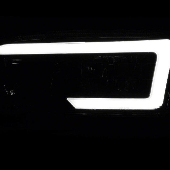 Raxiom 99-06 Chevrolet Sierra 1500 Axial Series LED DRL Headlights- Black Housing- Clear Lens